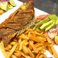 Mojarra Frita · Fried whole tilapia fish. Served with rice and salad.