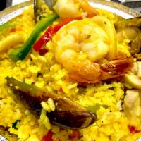 Arroz con Mariscos · Peruvian style paella, yellow rice with seafood.