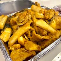 Jalea · Deep seafood with shrimp, mussels, clams, squid and crab, over fish fillet. Served with frie...