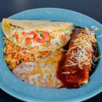 3. Enchilada and Taco · One enchilada topped with shredded cheese and red enchilada sauce garnished with lettuce and...