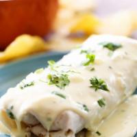 Smothered Burrito · Your choice of one of our Anaconda burritos topped with queso dip