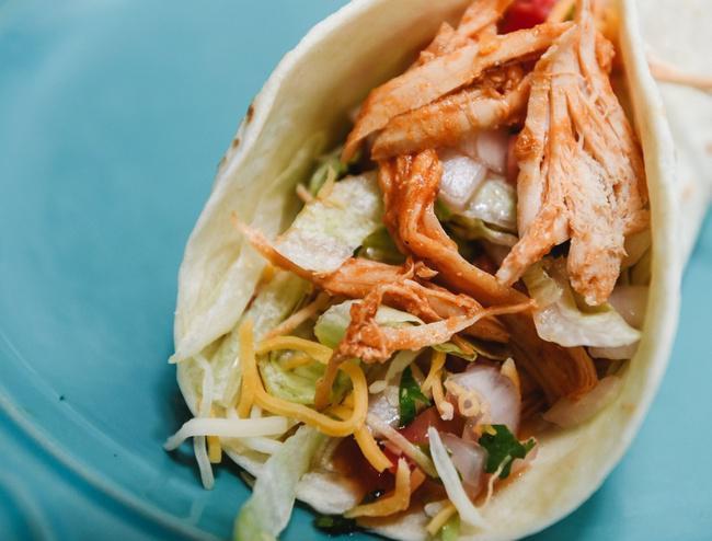 Chicken Taco · Fresh grilled chicken taco served in a soft flour tortilla filled with lettuce, cheese, and pico de gallo