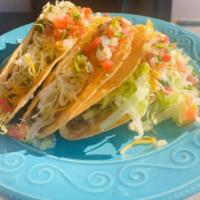 Fried Taco · Hard shell corn taco filled with lettuce, cheese and pico de gallo. Fresh ground beef or chi...