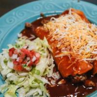 Beef Enchiladas · Two ground beef enchiladas topped with cheese garnished with lettuce and pico de gallo