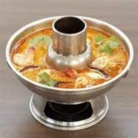 S2. Tom Yum Goong ( Hot Pot ) · A tart and spicy shrimp soup with galangal, kaffir lime, lemongrass, mushrooms and lime juic...