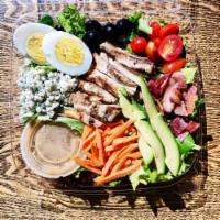 Paesano's Cobb Salad · Mix of mesclun and romaine greens with grilled chicken, bacon, avocado, sliced hard-boiled e...