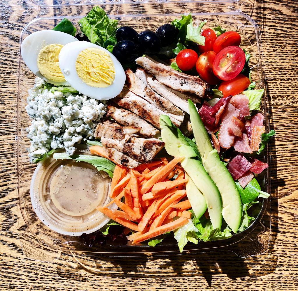 Paesano's Cobb Salad · Mix of mesclun and romaine greens with grilled chicken, bacon, avocado, sliced hard-boiled egg, Gorgonzola blue, cheese, tomatoes, olives, carrots and cucumbers.