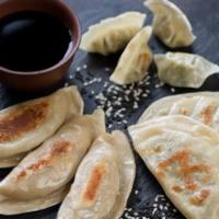 Veggies Potstickers (6 pcs) · Steamed or fried dumplings made with wheat flour, onions, cabbage, carrots, leeks, and black...