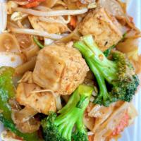 Pad See-U · Pad see-u stir-fried rice noodles, broccoli, carrots, and cabbage in a homemade soy sauce.