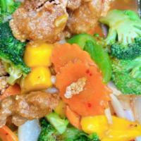Sauteed Mango · Sauteed fresh mango, bell peppers, carrots, onions, and broccoli in a homemade roasted chili...