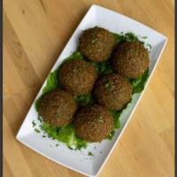 Falafel · 8 pieces. Vegetarian patties made with chick peas, onion fresh parsley, mild herbs, fried in...