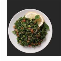 Tabouleh Salad · Cracked wheat mixed with tomatoes, parsley, onion, lemon juice and extra virgin olive oil.