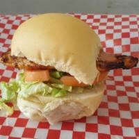 Chipotle Chicken Sandwich · Grilled chicken breast sandwich on a ciabatta bread with lettuce, tomato and chipotle sauce....