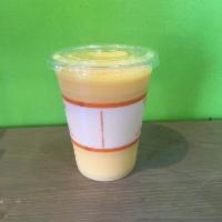 Tropical Sunset Smoothie · Mango, peaches, pineapple, orange juice.