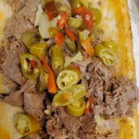 Homemade Italian Beef Sandwich · A sandwich composed of thin slices of seasoned roast beef, simmered and served with au jus o...