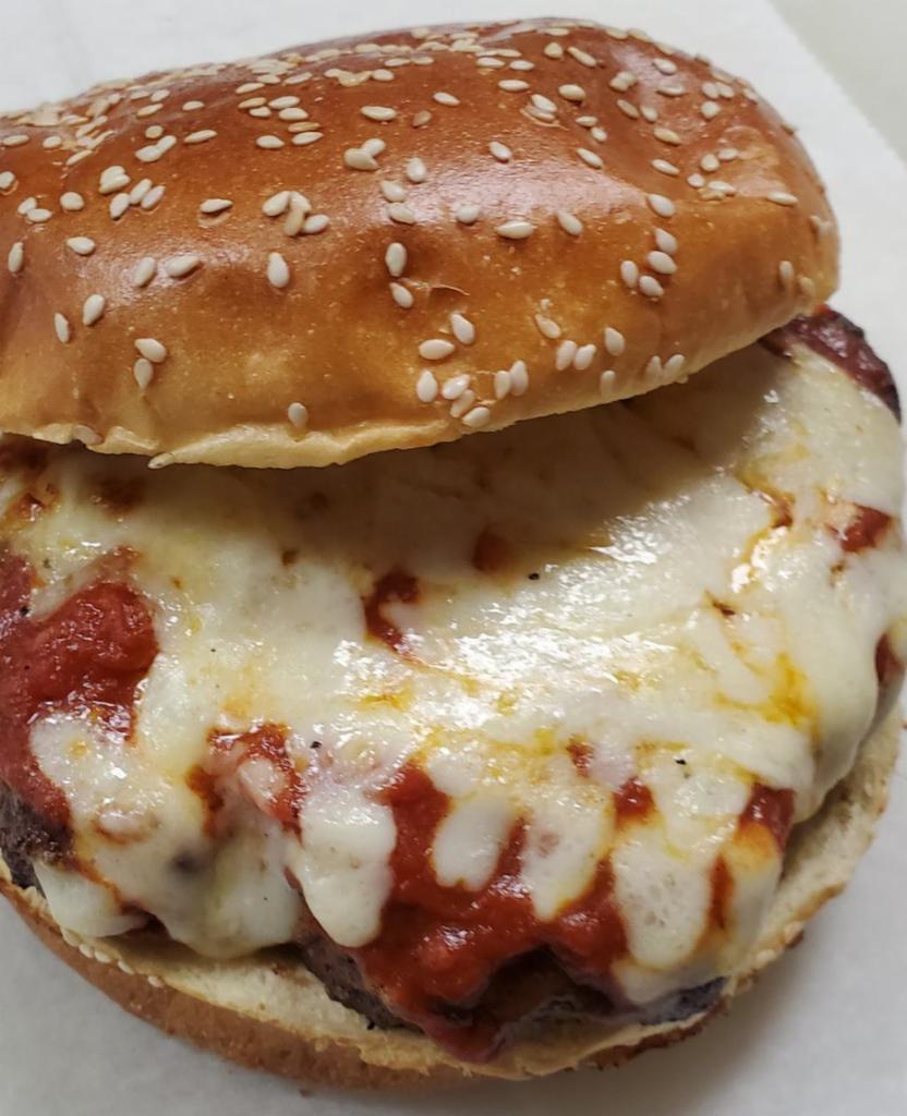 Pizza Burger · Meat patty with pizza sauce and cheese.