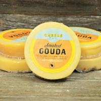 Smoked Gouda Cheese 6 oz. · This classic combines the rich, caramelly flavors of Gouda with natural smoke from wood fire...