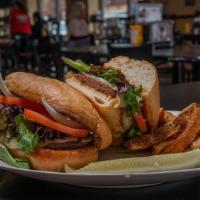 Taproom Ultimate Grinder Sandwich · Italian sausage with provolone cheese, mixed greens, tomato and white onion on a hoagie bun.
