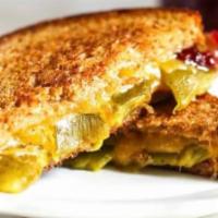 Pueblo Chile Grilled Cheese · Aged cheddar cheese, strawberry jam, and Pueblo Green Chili in buttery white bread.