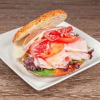 Siciliano Sandwich · Prosciutto, soppresata, ham, provolone cheese, tomato, red onion, mixed greens and garlic ai...