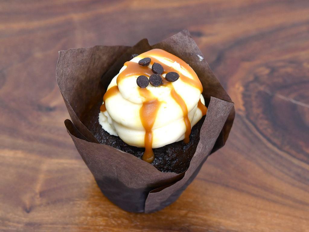 7oz. Gluten Free Chocolate Cupcake · A gluten free chocolate cupcake topped with salted caramel buttercream and salted caramel drizzle.