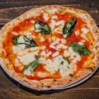Margherita Pizza · Plum tomato sauce, mozzarella cheese, basil, extra virgin olive oil.