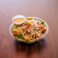 Classic Caesar Salad · Romaine lettuce, portabella mushrooms, tomatoes, mozzarella cheese, Caesar dressing topped w...