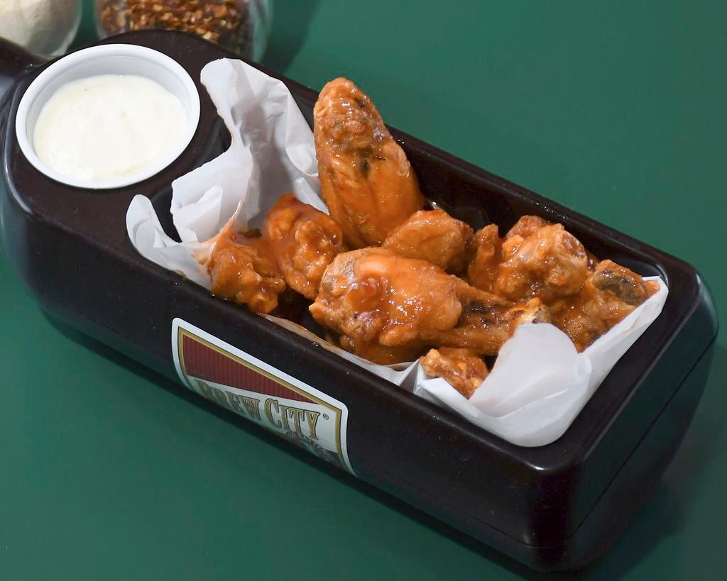 Bone-In Chicken Wings · 10 Bone-in wings.  Your choice of naked or coated in homemade sauce.
Garlic Parm, Mild, Hot or Boo. 