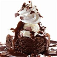 Chocolate lava meltdown · Warm chocolate cake, french vanilla ice cream, whipped topping, fudge and shaved chocolate.