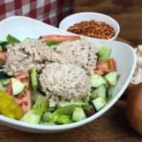 Tuna Salad · Our fresh homemade tuna salad on top of crisp lettuce, sliced red ripe tomatoes, onions, cuc...