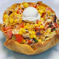 Taco Salad · Ground beef or grilled chicken. Served in fried tortilla shell with lettuce, onions, corn, t...
