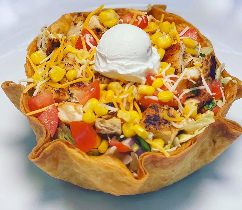 Taco Salad · Ground beef or grilled chicken. Served in fried tortilla shell with lettuce, onions, corn, tomato, cheese, sour cream, and salsa.
