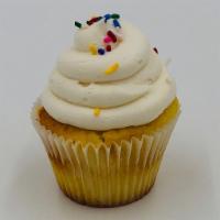 Vanilla Cupcake · Vanilla cake topped with vanilla buttercream and rainbow sprinkles.