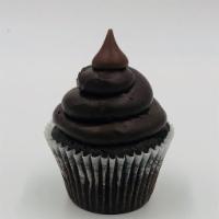 Blackout Cupcake · Chocolate cake topped with chocolate buttercream and a Hershey's Kiss.
