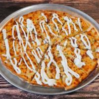 Loaded Baked Potato Pizza · Ranch base, sliced potatoes, butter, real bacon, chives, mozzarella, and cheddar cheese.