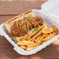 Grilled Cajun Chicken Po'boy · Juicy grilled chicken breast served on a toasted French baguette dressed in a creamy Cajun s...
