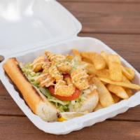 Fried Shrimp Po'boy · Cajun battered shrimp served on a toasted French baguette dressed in a creamy Cajun sauce to...