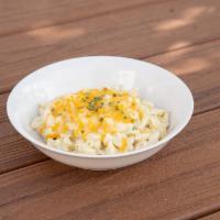 Mac & Cheese · Macaroni pasta tossed in our famous house made creamy cheese sauce. 