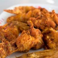 #7b Fried Chicken Wings · Six seasoned, deep-fried wings covered in a sweet and tangy sauce