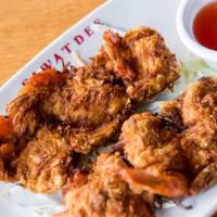 #9 Coconut Shrimp · Six shrimp rolled in coconut & fried.