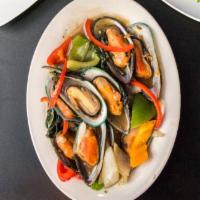 #34 Sawatdee Mussels (18) · With Thai basil and wine sauce OR red curry and ginger sauce.