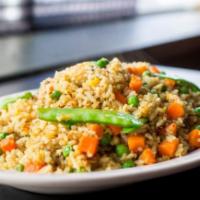 #55b Curry Fried Rice · Egg, yellow curry, carrots, peas & peapods. Topped with green onions.