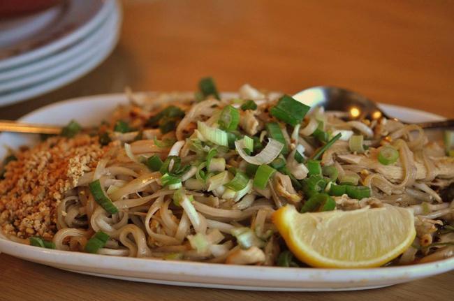 #58 Pad Thai · Rice noodles, egg & bean sprouts. Topped with ground roasted peanuts & green onions. The national dish of Thailand! Gluten-Free.