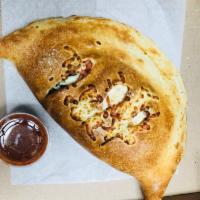 Chicken Stromboli · Grilled chicken, sweet peppers and fried onions made with fresh dough.