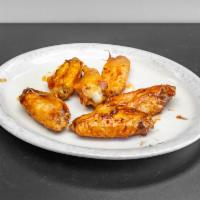 Hot Wings · Hot, BBQ, teriyaki baked chicken wings in hot sauce with a side of blue cheese.