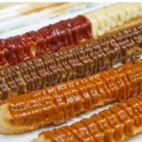 Premium Yummy Churros · Traditional cinnamon or sugar churros with toppings or your choice.