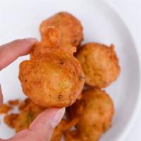 Conch Fritters · Chopped conch meat mixed with a batter made from flour and deep fried in oil.