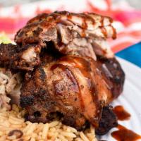 Jerk Chicken Dinner · Grill chicken with Jerk seasoning serve with Rice and Peas and plantains