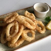Calamari · Lightly fried calamari served with tartar sauce.