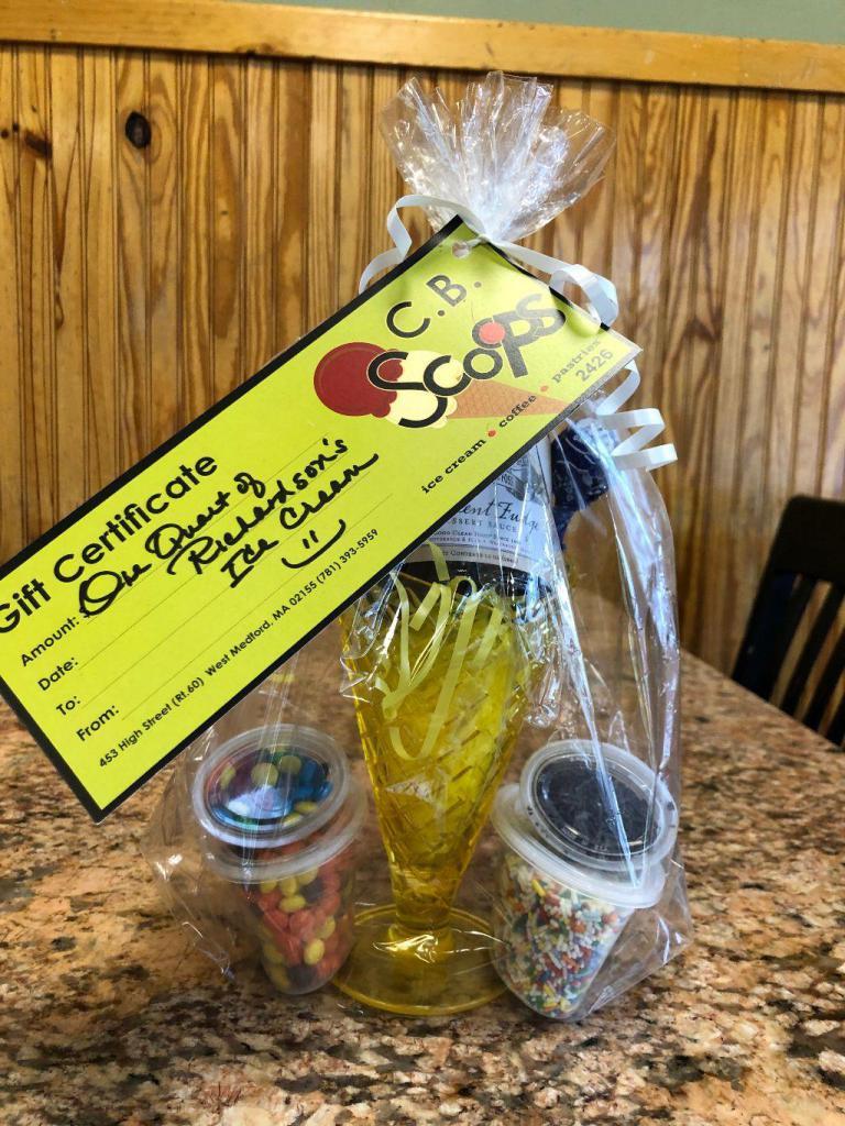 Ice cream Sundae gift basket · Includes a gift certificate for a quart of Richardsons ice cream, An ice cream sundae cup, jar of hot fudge and 4 toppings